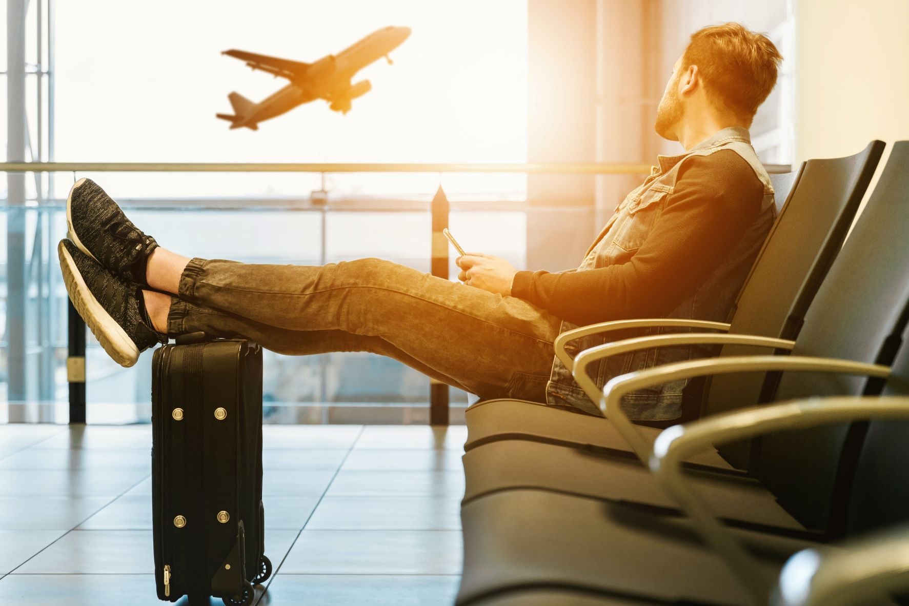 airport traveler watching planes