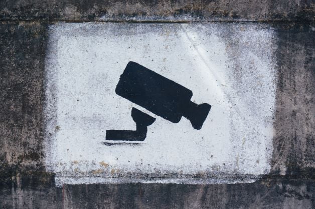 painted surveillance sign