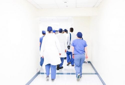 healthcare workers walking down the hall