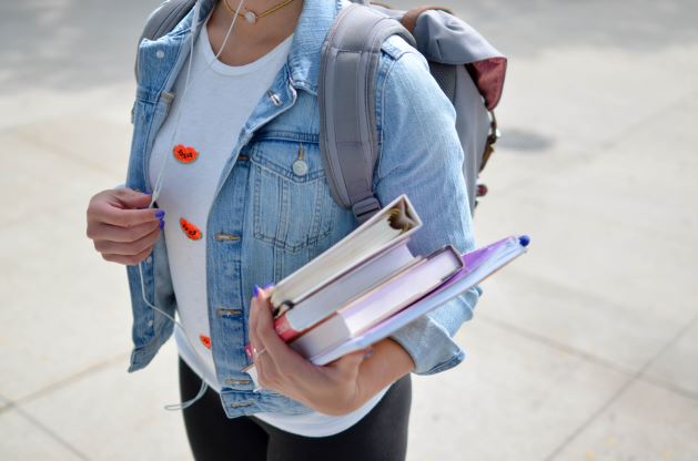 International student carrying text books