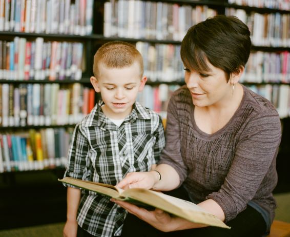 Teacher reading with a student