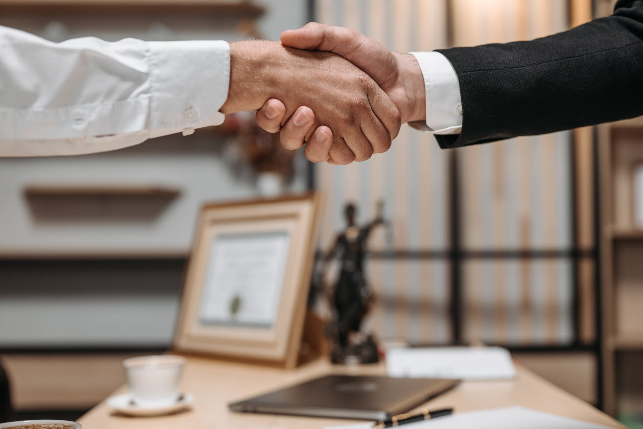 a lawyer shaking hands with a client