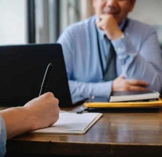 an employer and employee in an office